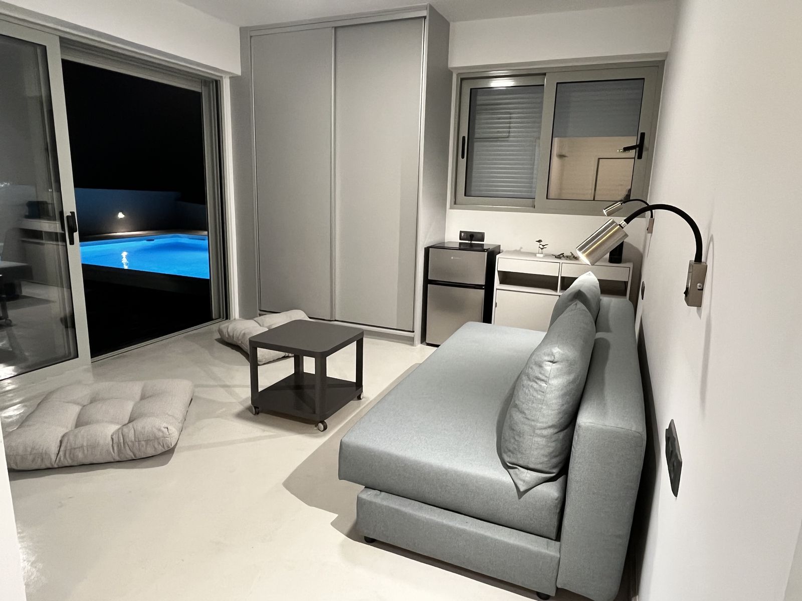 The second bedroom's desk and fitted wardrobe beside the sofa bed.
