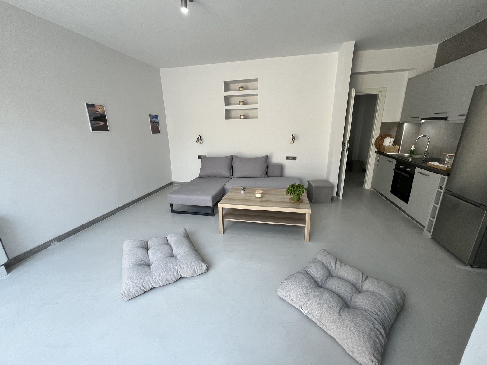 The living room from the corner, with the kitchenette beyond.