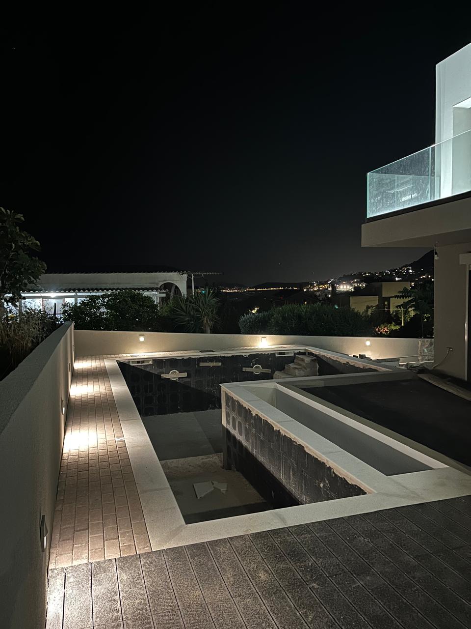 The pool looking out over the gulf and distant town lights.